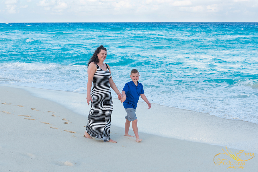 cancun mom son walking on the beach