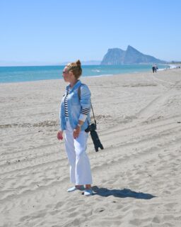 Standing on a beach in Spain, looking toward the Rock of Gibraltar, you realize you’re seeing more than a landscape, it’s a rare moment where distance feels symbolic rather than physical. Across the narrow stretch of water lies Africa, behind you stretches Europe, and within one view, three identities coexist: Spain, Gibraltar (a British Overseas Territory), and Morocco. All connected, all present, separated only by a thin line of water that feels less like a barrier and more like a quiet transition.

For me, this place felt unexpectedly personal, as if the landscape reflected something I hadn’t fully articulated. Over the years, moving across seas and continents, living in different countries, shaped how I understand movement, belonging, and identity.

Looking at Africa in the distance, with Gibraltar and Spain on the same horizon, it mirrored that experience of living between cultures and languages. Now, it felt aligned.

We, as humans, create borders, define countries, and build systems that control movement.

And yet, here is a place shaped entirely by nature that quietly dissolves those divisions. From one point, land, water, light, and distance exist together without restriction or hierarchy. It’s a reminder that the world, in its natural form, is far more fluid, open, and interconnected than the structures we impose.

Standing at this intersection of continents and cultures invites a quiet reflection that emerges simply from being there. It stays with you by offering perspective. Looking across the water, you can feel an invisible connection, as if the world and your own story aligns for a moment.

Back at home, while editing my photos, I found myself thinking about Africa, so far away, yet unexpectedly close. In some images, the coastline looks like a mirage, softened by light and distance, somewhere between reality and imagination.

The Rock of Gibraltar feels more than a landmark; it’s a reminder that distant, uncertain goals can come within reach if you keep moving toward them. Distance is not always a limitation, it’s often just perspective.

#spain #travel #rockofgibraltar #andalusia #traveling
